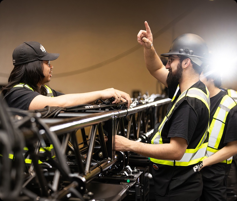 People installing sound equipment