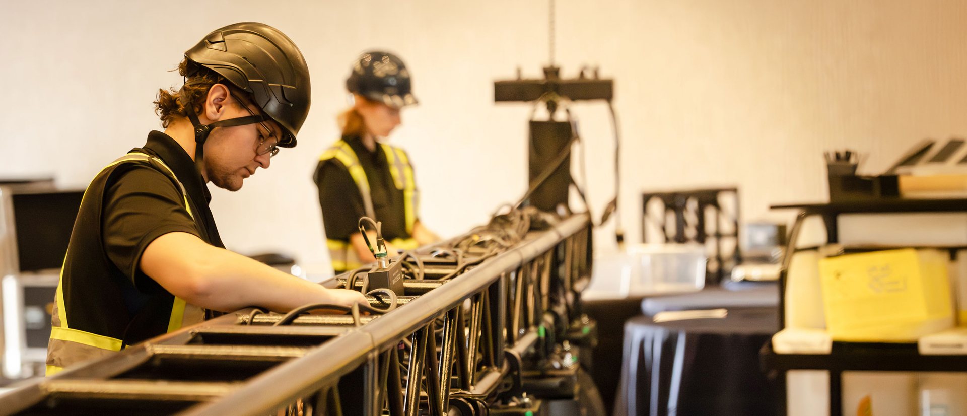 Technicians installing sound equipment