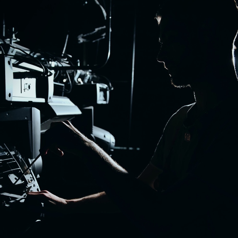 Man fixing sounf equipment issue